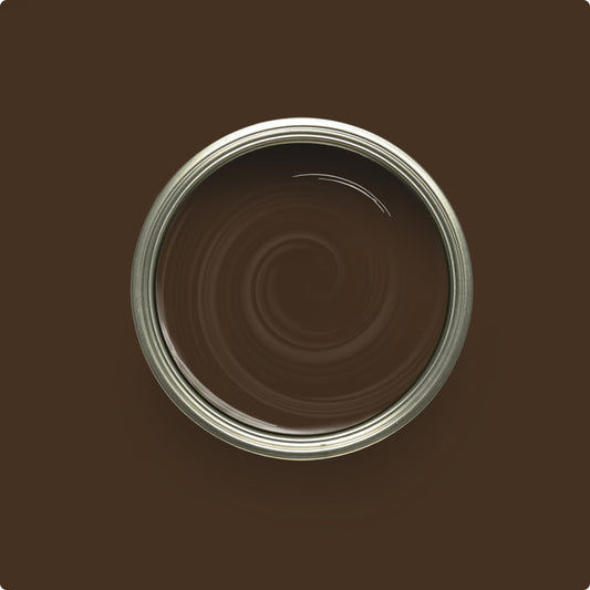 Close-up of a brown paint can with swirling pattern on a brown background