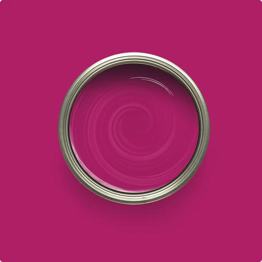 Close-up of a pink paint can with swirling pattern on a pink background